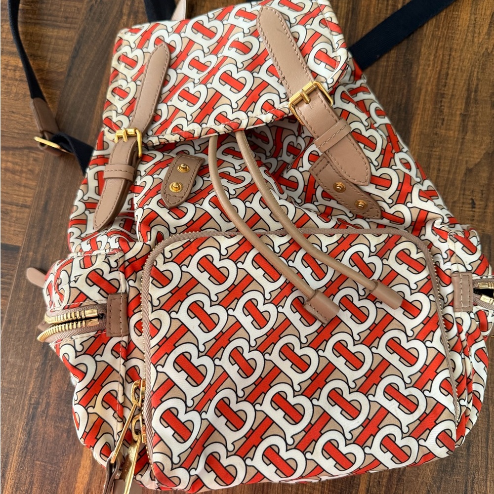 Chic Patterned Backpack with Tan and Red Accents - image 1